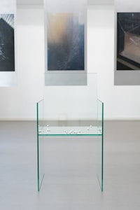 a glass display with several photographs on it