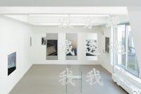 a white room with a lot of pictures on the wall